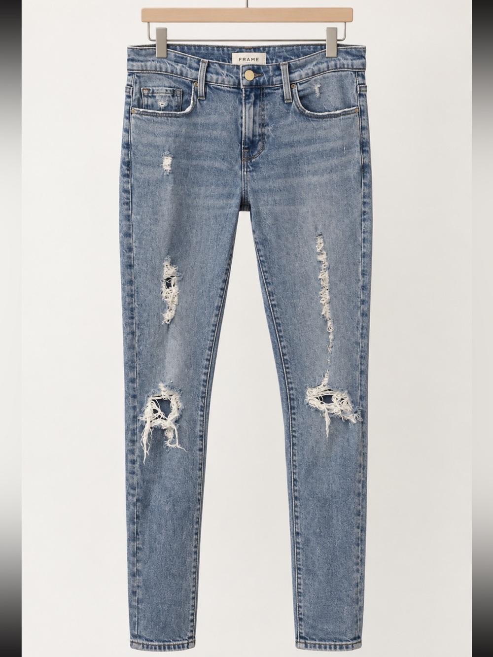 Frame Denim Light Wash Distressed Skinny Jeans